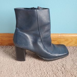Navy blue leather ankle boots.